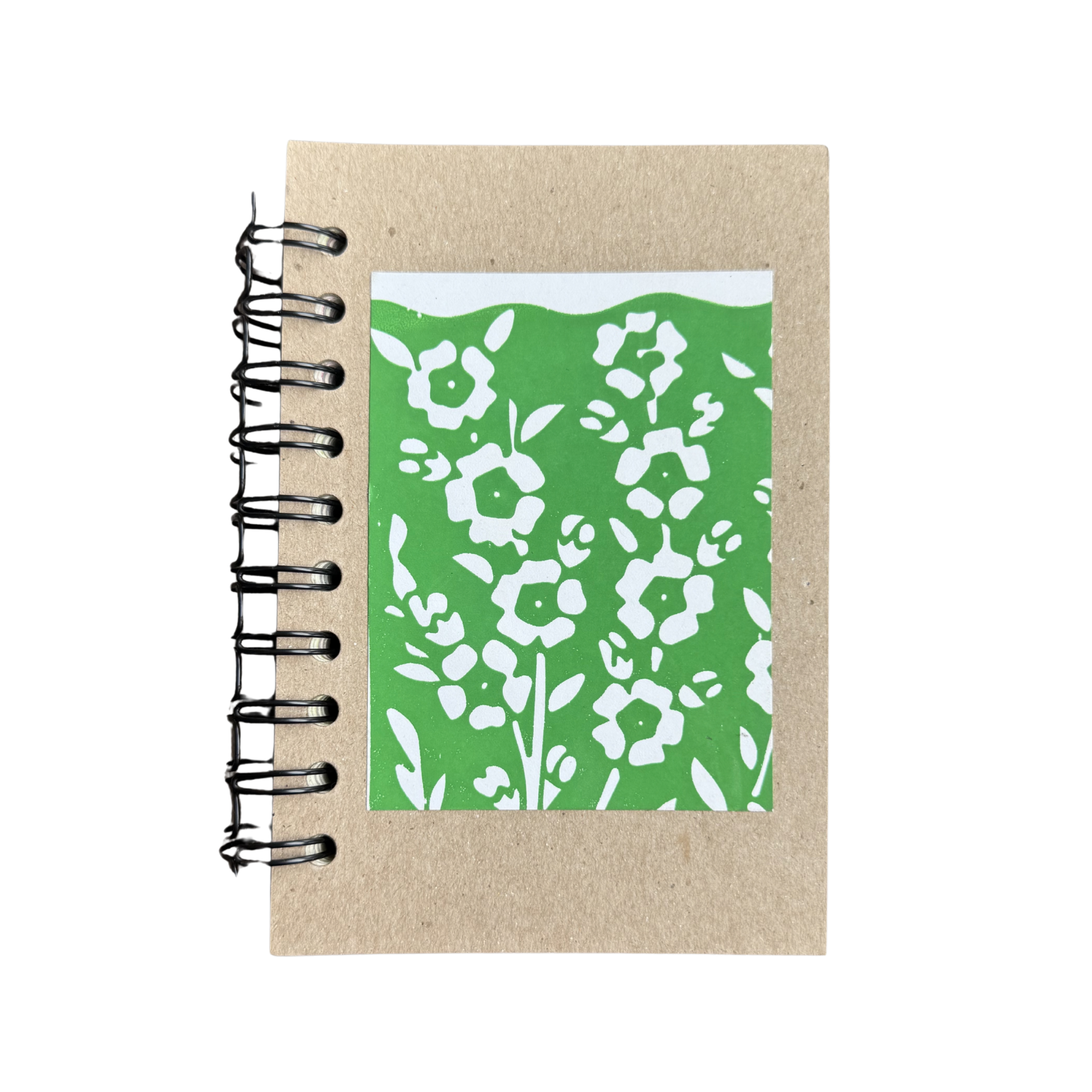 Notebook with a floral design on a green background