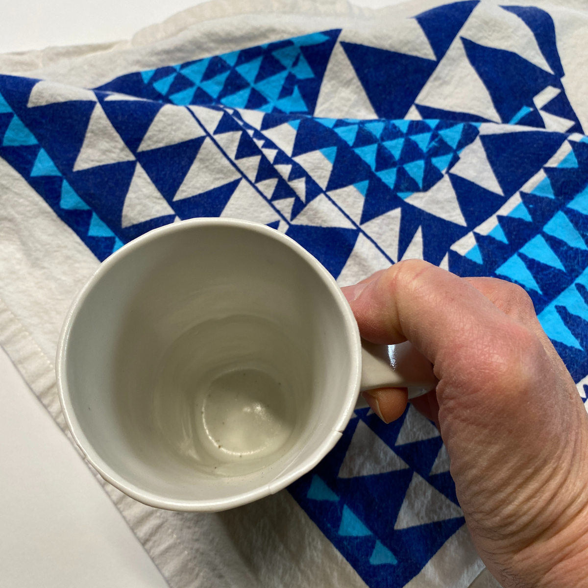 Handmade porcelain Dolphin Studio mug by Dan Bellow