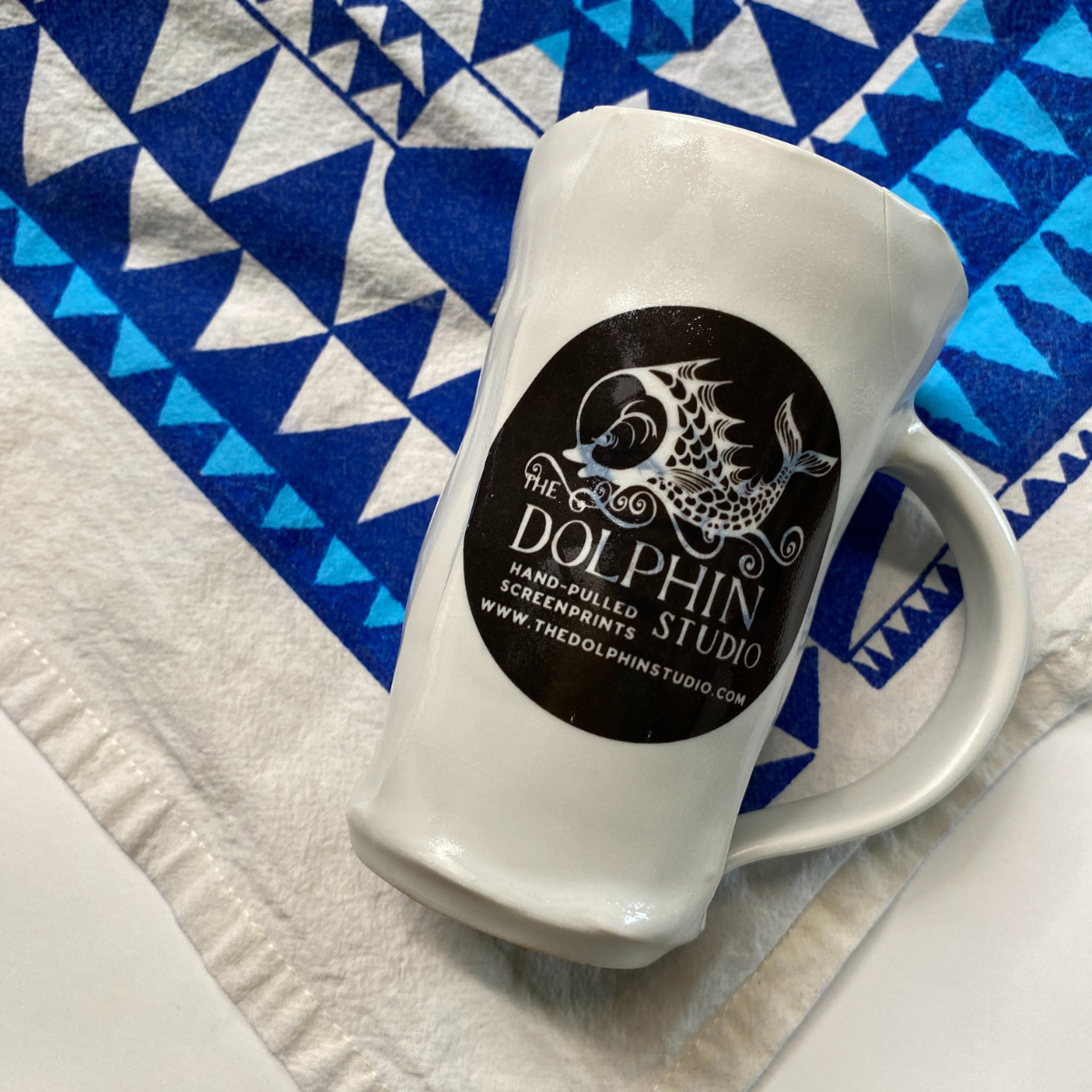 Handmade porcelain Dolphin Studio mug by Dan Bellow
