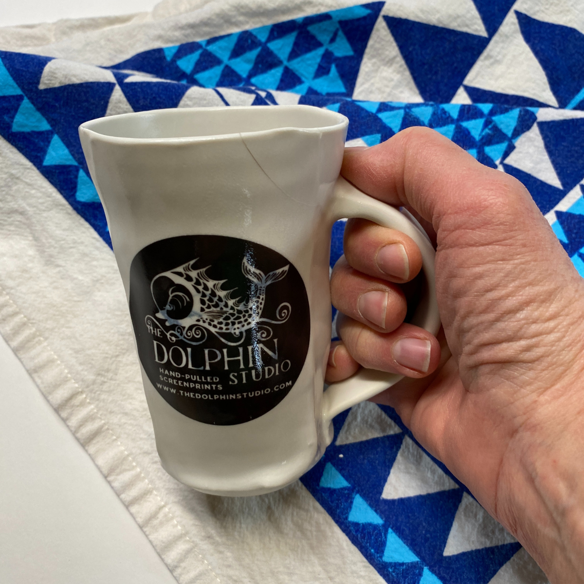 Handmade porcelain Dolphin Studio mug by Dan Bellow
