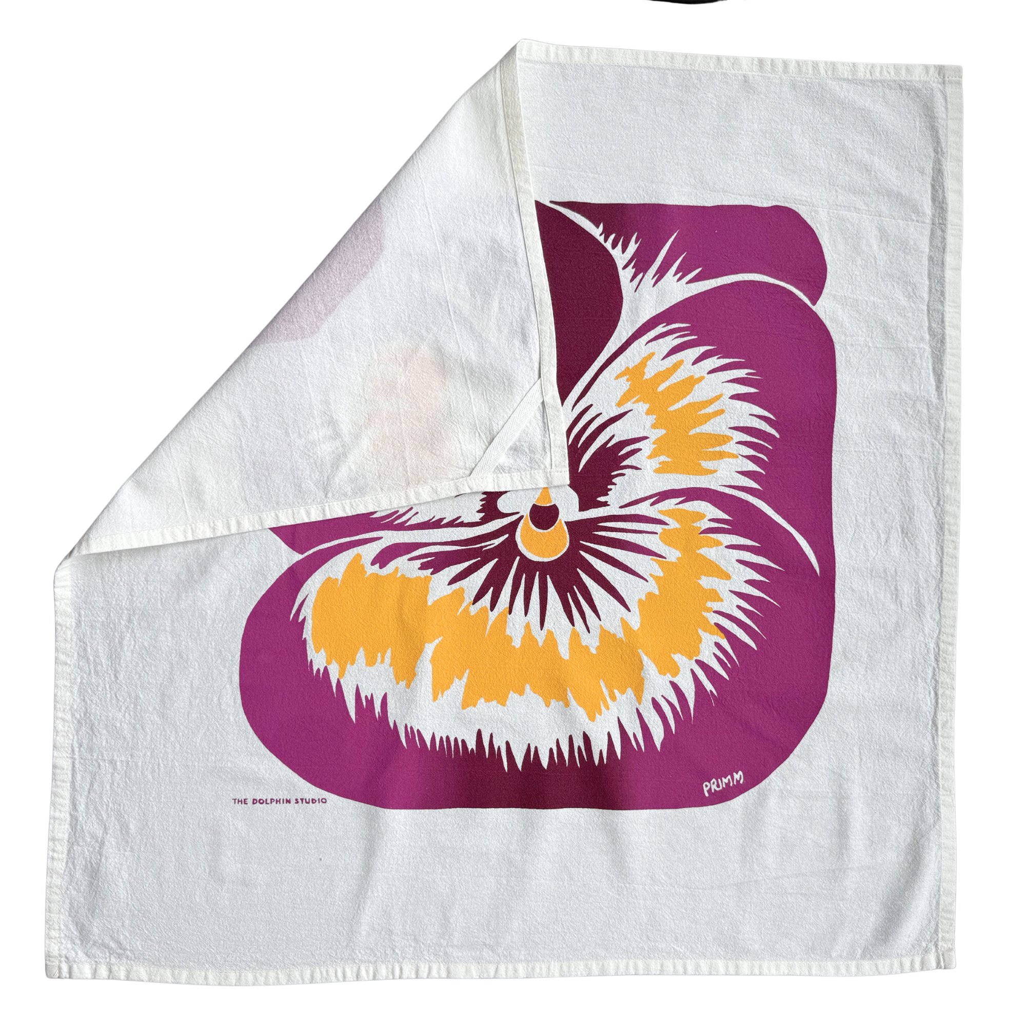 Floral design on a white fabric with purple, yellow, and white colors.